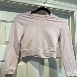 Light pink Lululemon workout crop top